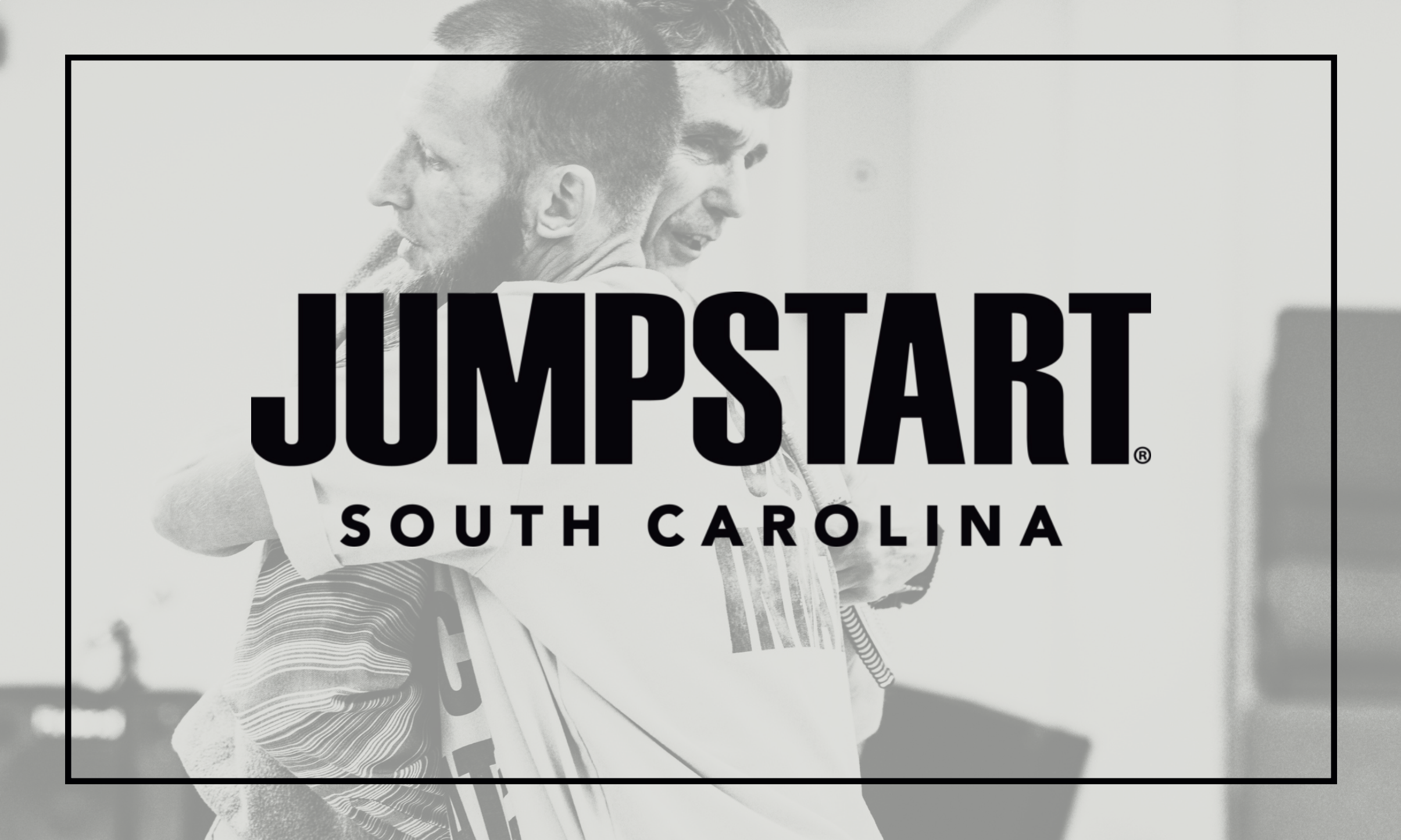 Jumpstart South Carolina — two men embracing inside a correctional facility, representing transformation and brotherhood through prison ministry