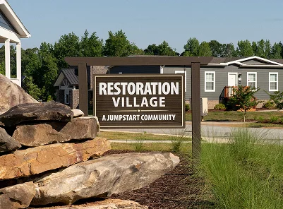Restoration Village sign